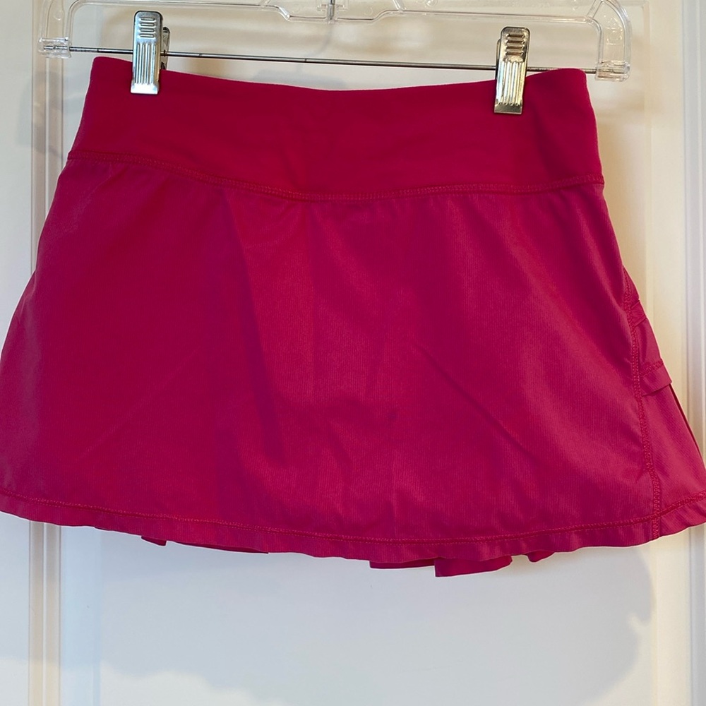 Aviva hot pink (sonic pink) tennis skirt with built in shorts in size 10 girls.